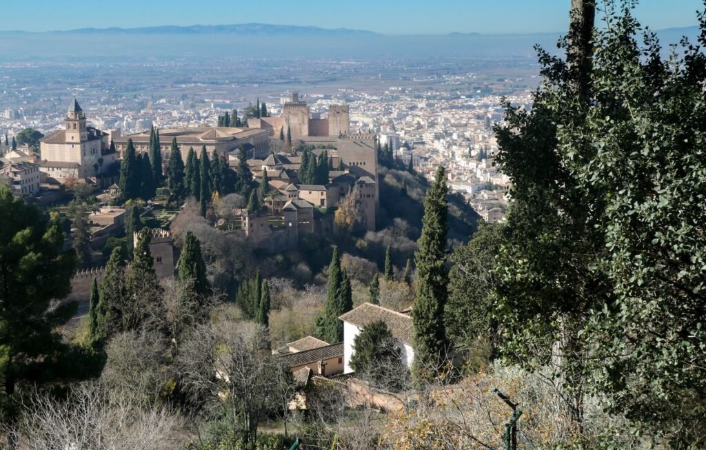 The Alhambra complex on its wooded hill above Granada.