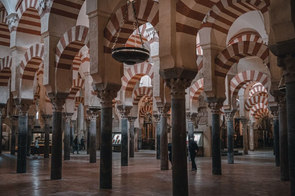 Rows of striped arches inside the Mosque-Cathedral of Cordoba.