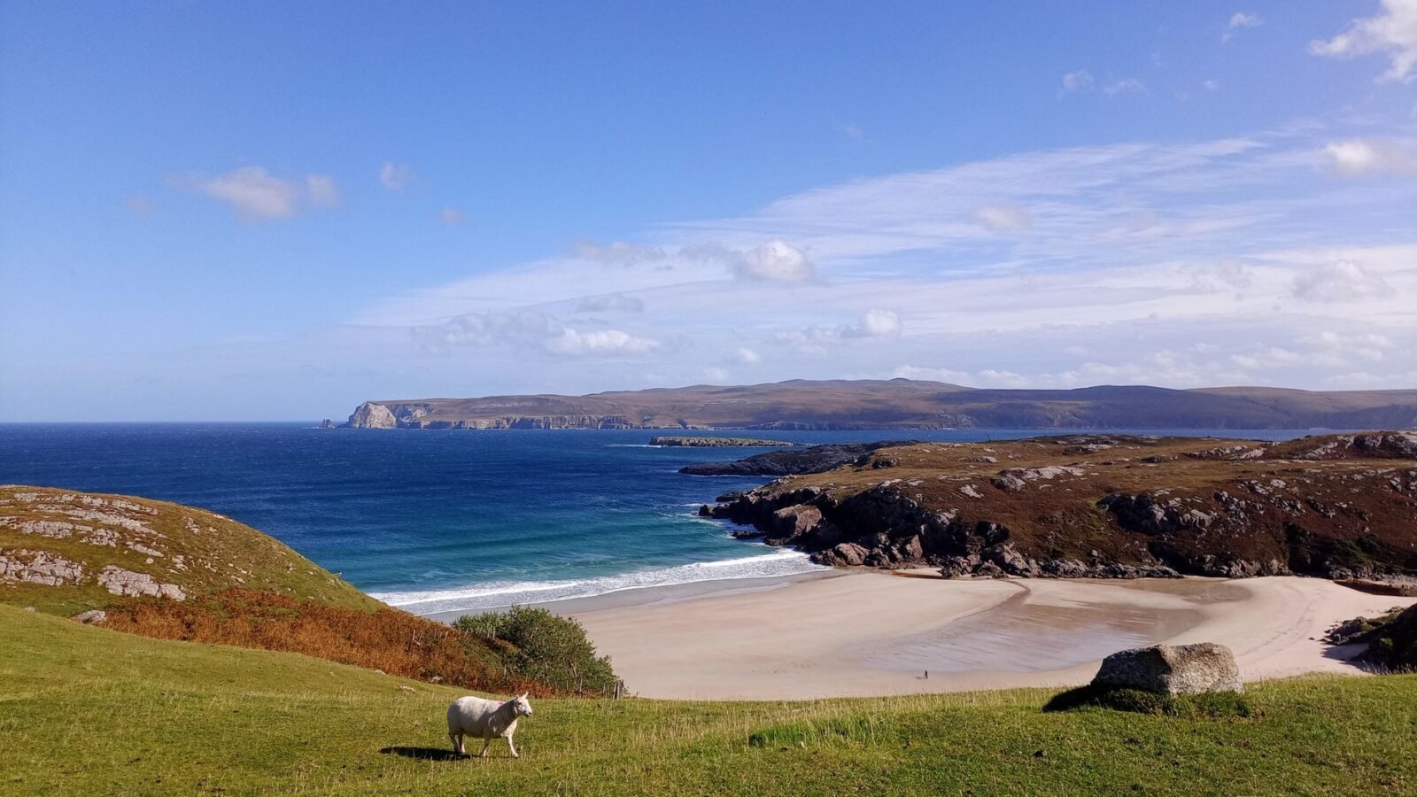 Sandy beach, turquoise water and rocky headlands at Durness in northern Scotland.