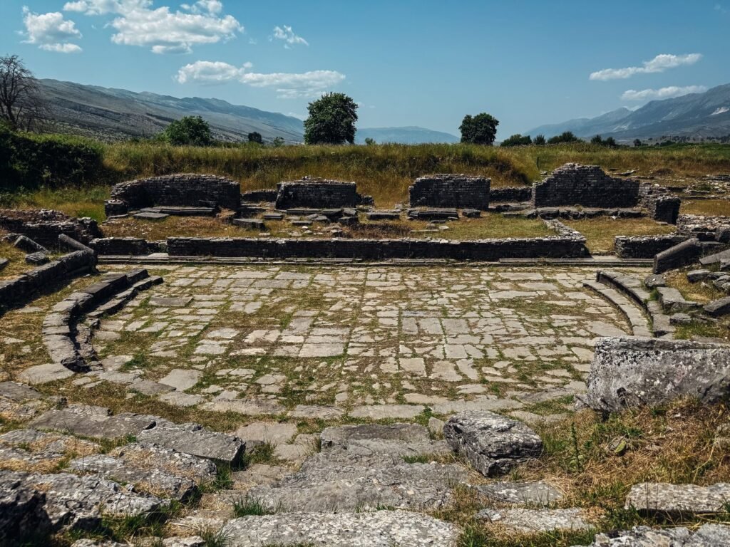 Stone seating and stage remains of the ancient theatre at Butrint in Albania.