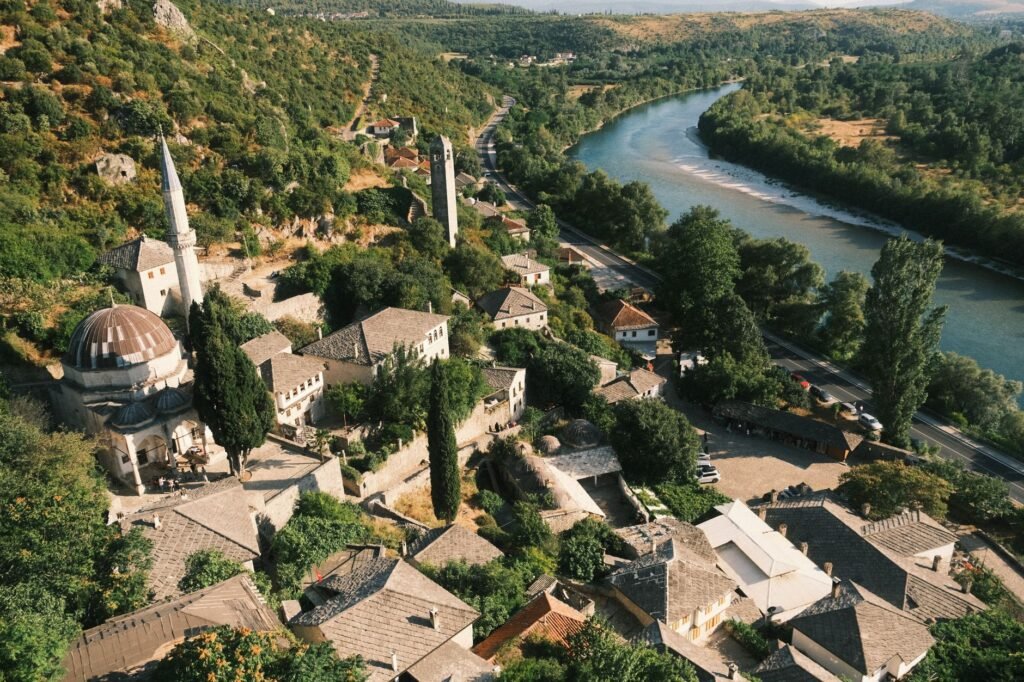 Historic stone buildings of Počitelj on a hillside above the Neretva River in Bosnia and Herzegovina.