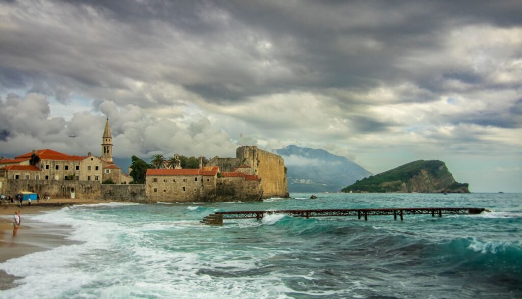 Historic stone buildings of Budva Old Town beside the Adriatic coast in Montenegro.