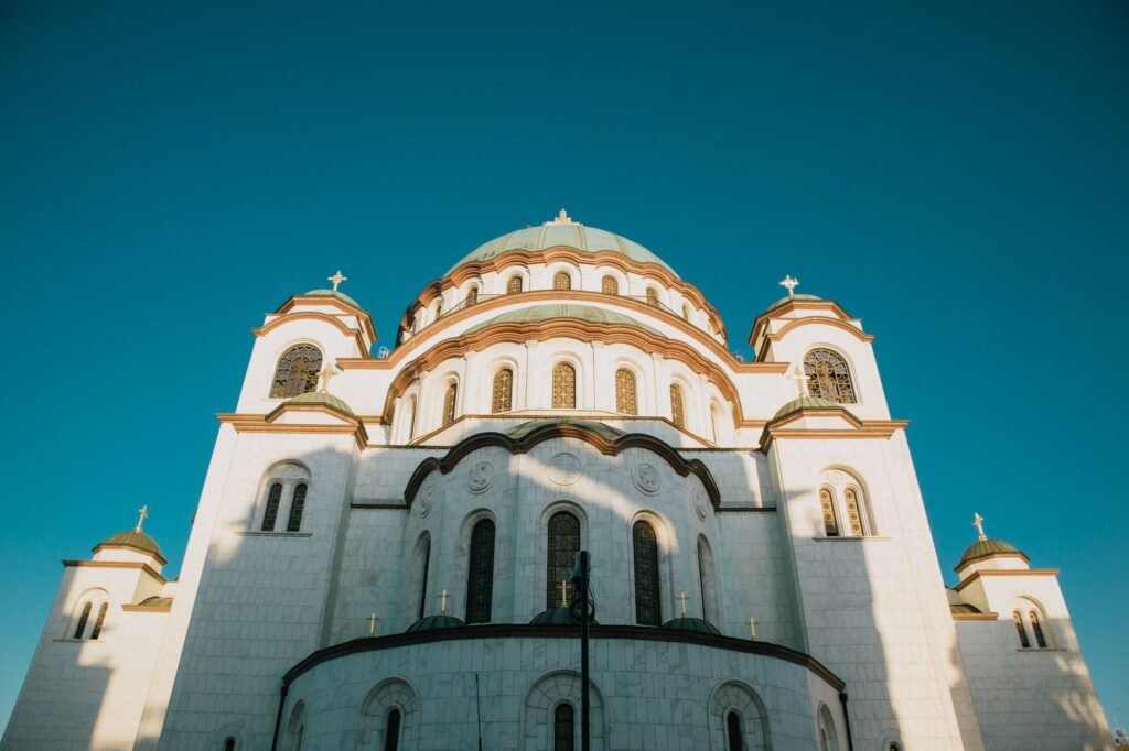 White stone exterior and domes of the Temple of Saint Sava in Belgrade, Serbia.